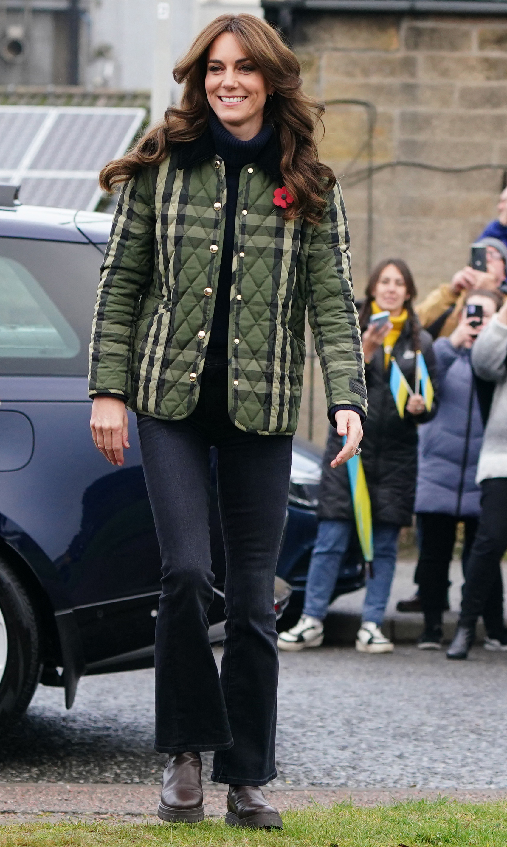Kate Middleton wearing a green plaid jacket