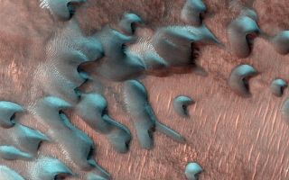 Frost coats sand dunes on Mars, in this NASA image from the Mars Reconnaissance Orbiter.