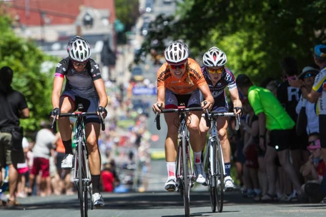 Three riders fight up the steep climb to try and stay off the front.