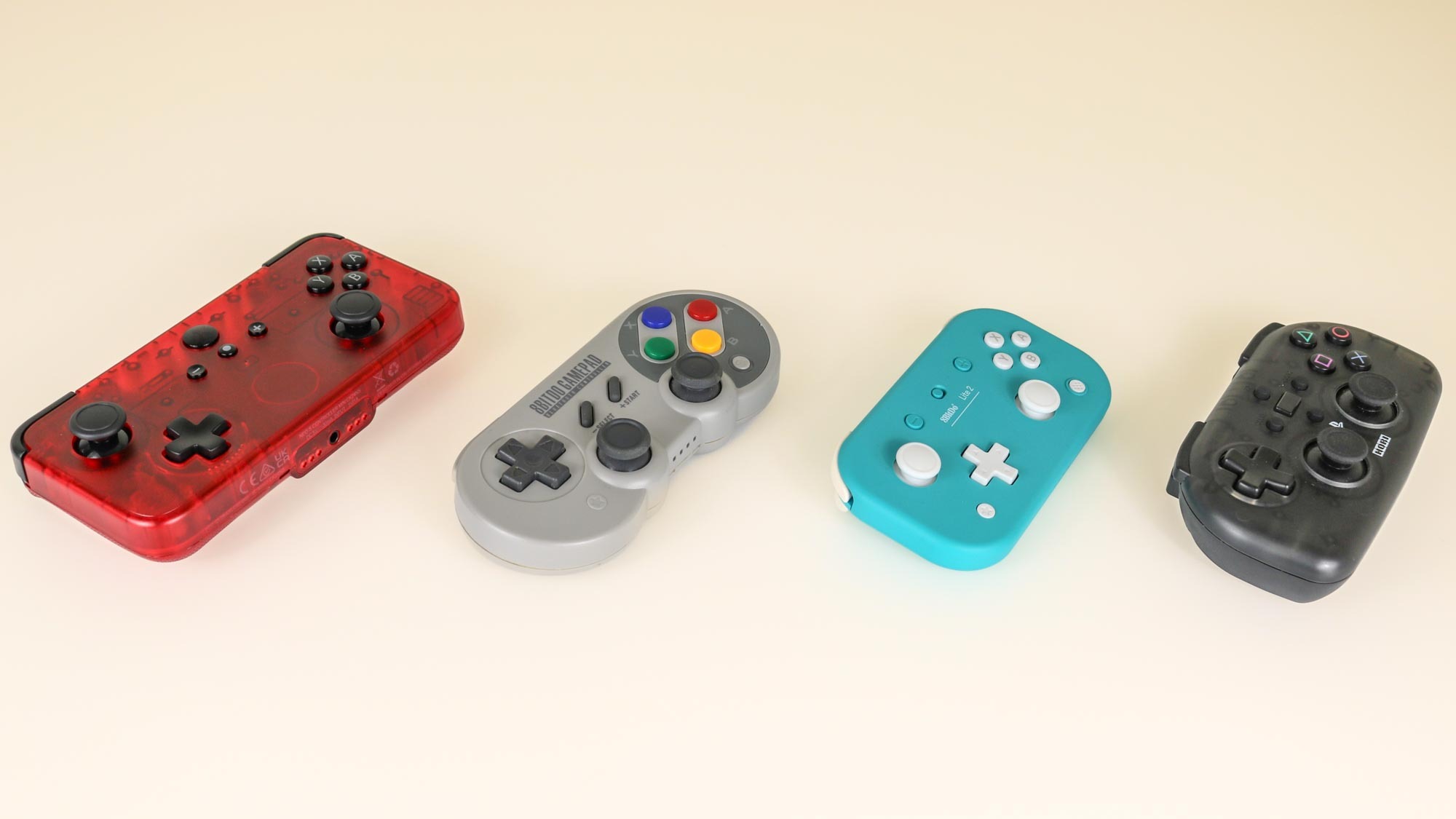 The CRKD NEO S controller on a desk alongside other gamepad-style controllers