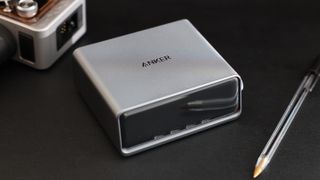 Anker Prime 250W desktop charger on a black leather mat