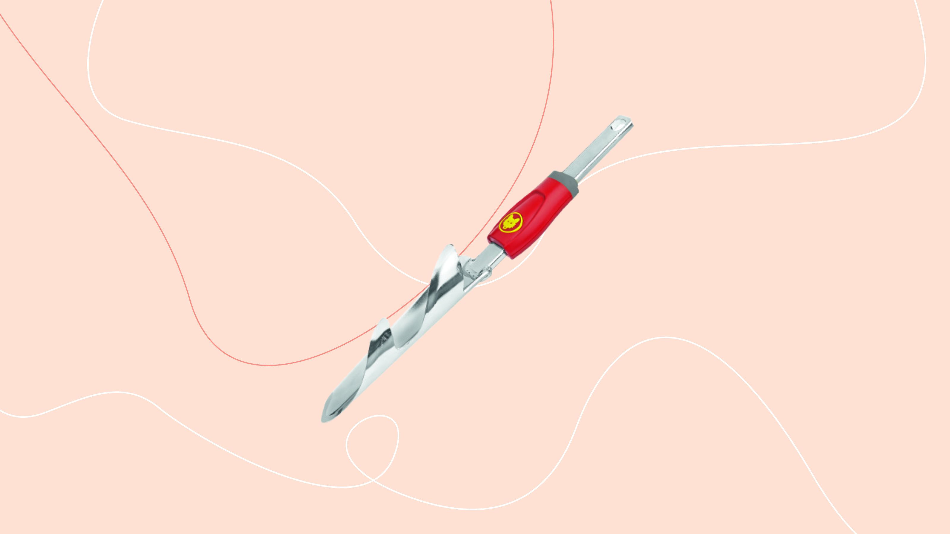 WOLF-Garten Weed Extractor tool on pink background