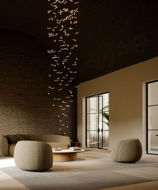 A large hanging light fixture in a minimalist living room