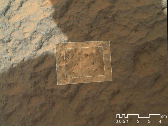 This image combines photographs taken by the Mars Hand Lens Imager (MAHLI) at three different distances from the first Martian rock that NASA's Curiosity rover touched with its arm. The three exposures were taken during the 47th Martian day, or sol, of Curiosity's work on Mars (Sept. 23, 2012). The team has named the target rock "Jake Matijevic." The scale bar is 4 centimeters (1.6 inches).