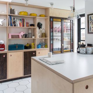 kitchen from other side with open shelving glass fronted cabinets and solid wood cupboards