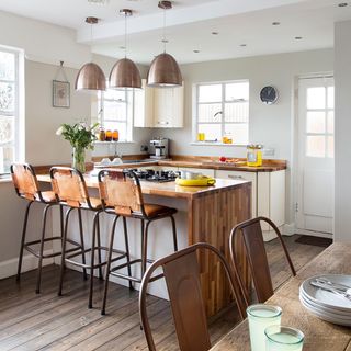 kitchen room with wooden worktop and ceiling lamp