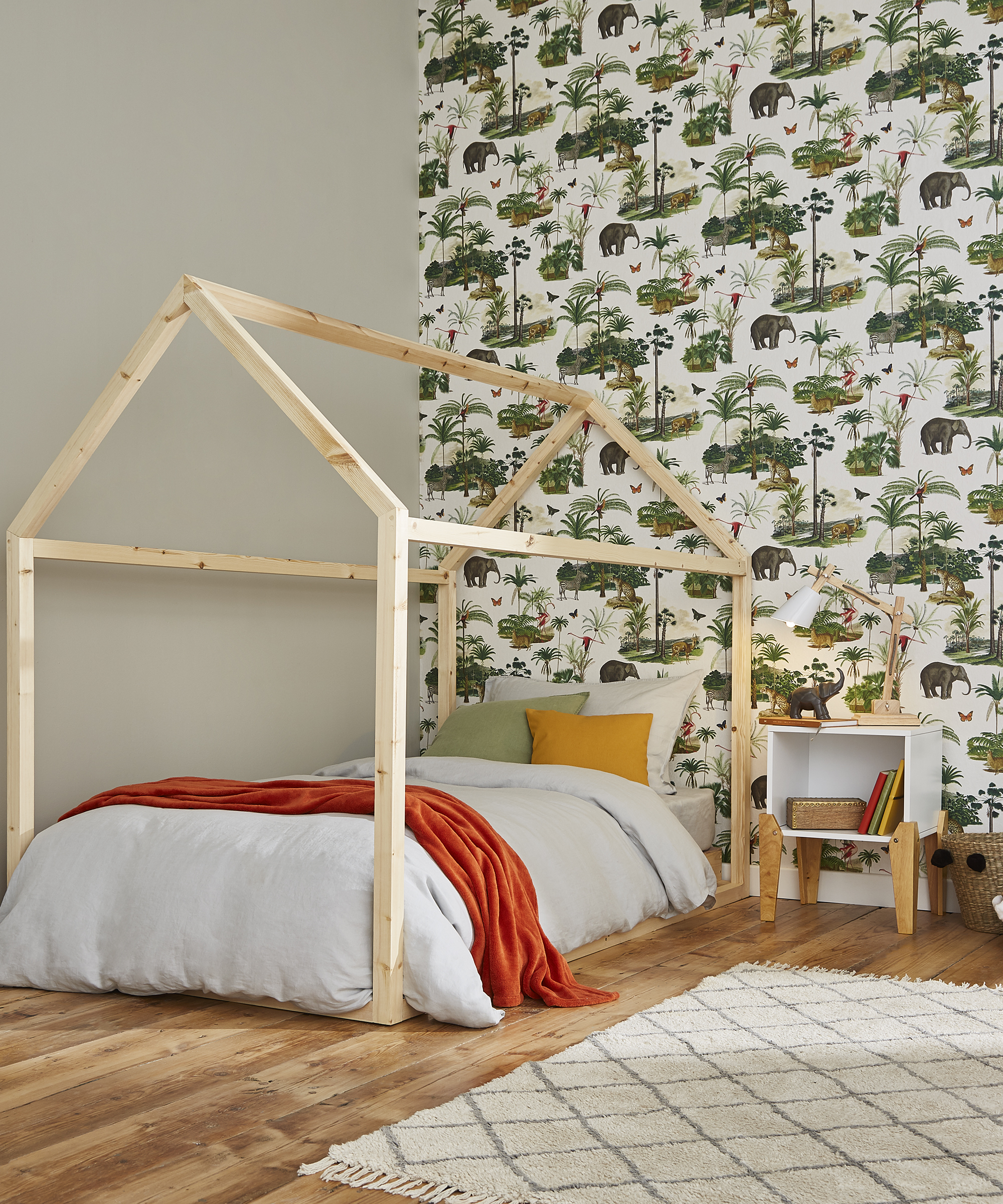 Safari printed wallpaper decor in boys bedroom by Graham and Brown