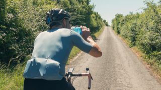 Cyclist drinking electrolytes