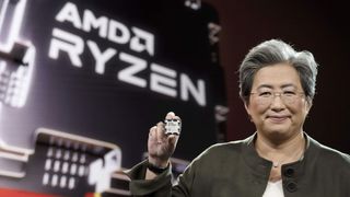Dr. Lisa Su holding an AMD Ryzen 9 7950X CPU