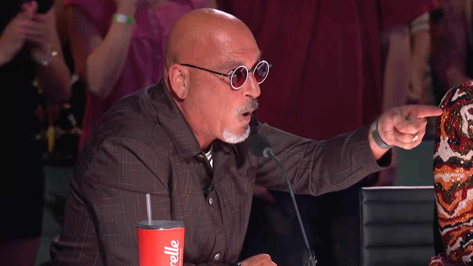 Howie Mandel points while reacting to a performance on America's Got Talent Season 21.