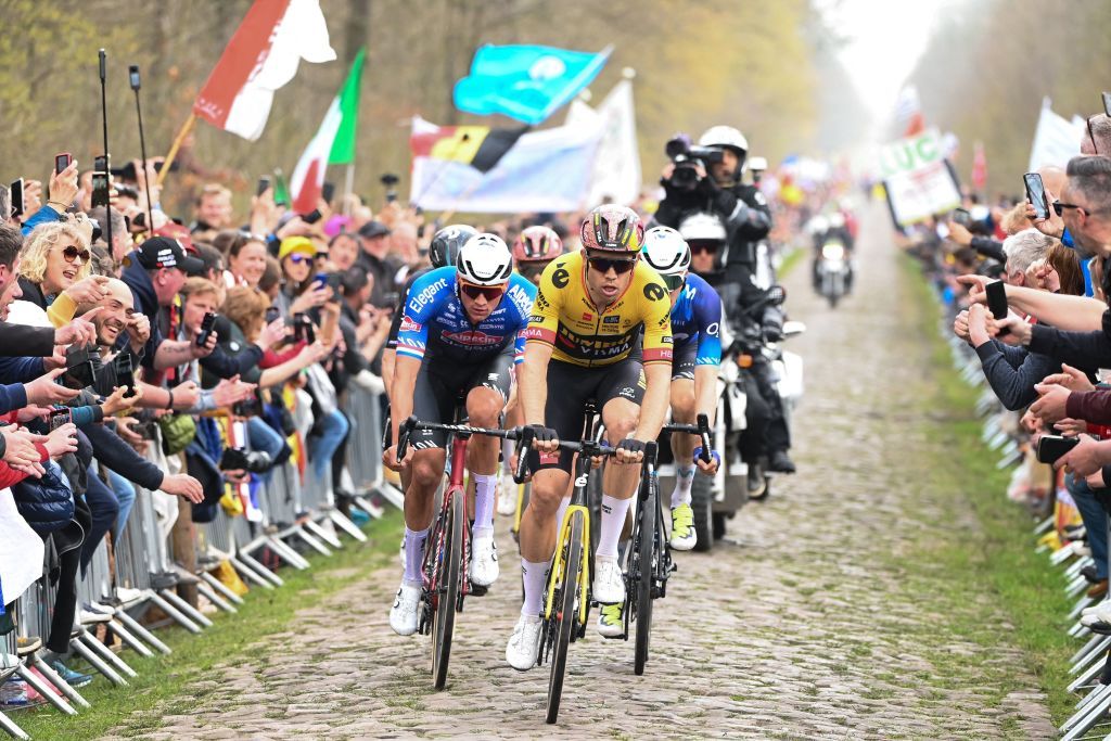 JumboVisma teams Belgian rider Wout Van Aert R and AlpecinDeceuninck teams Dutch rider Mathieu Van Der Poel C cycle with a pack of riders over the Trouee dArenberg cobblestone sector during the 120th edition of the ParisRoubaix oneday classic cycling race between Compiegne and Roubaix northern France on April 9 2023 Photo by AnneChristine POUJOULAT AFP Photo by ANNECHRISTINE POUJOULATAFP via Getty Images