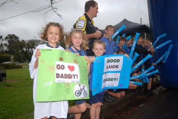 Children cheer on their dad Steve Petre