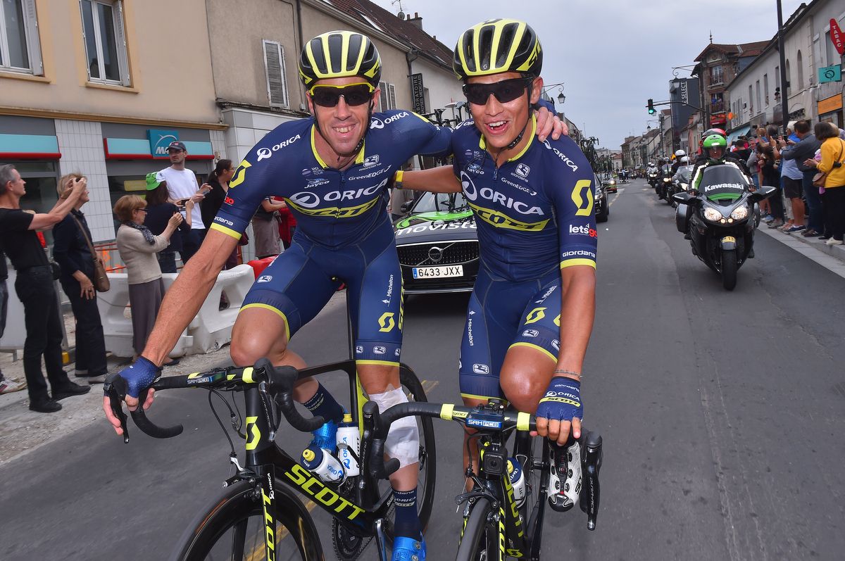 Orica-Scott's Mat Hayman and Esteban Chaves celebrate the arrival in Paris