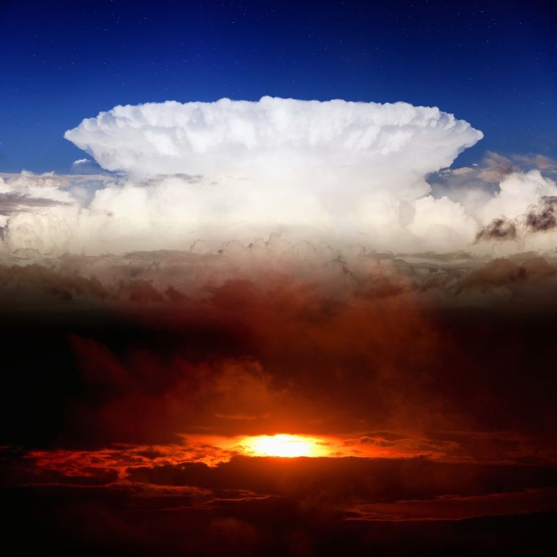 Dramatic background - dark red sunset, white clouds, blue sky, heaven and hell 