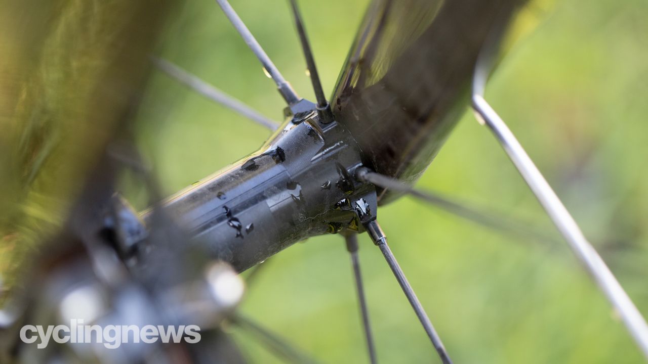 A black front hub with some drips of water on it