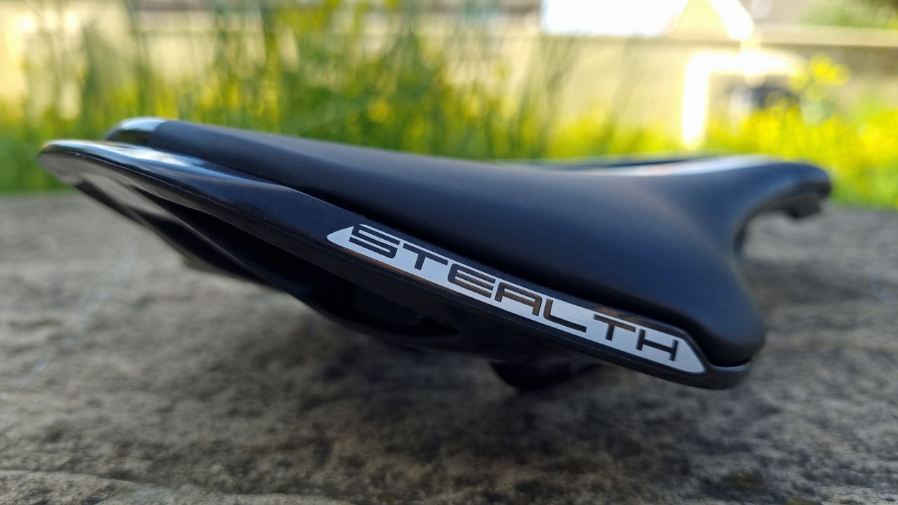 A close up of the Pro Stealth Carbon Saddle on a stone floor