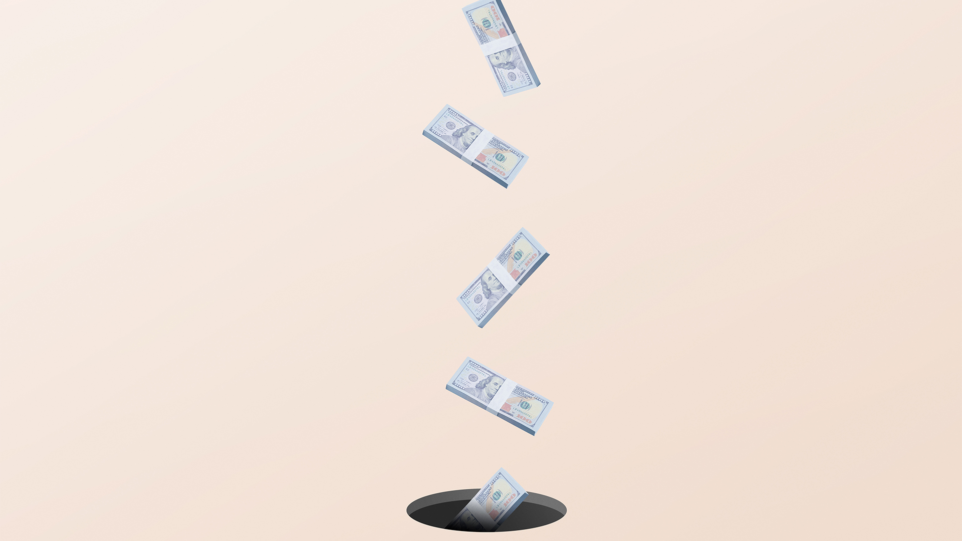 Irresponsible spending concept image showing stacks of dollar bills pouring down a drain.