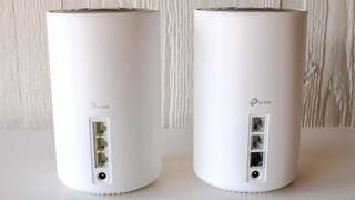 The rear ports of a TP-Link Deco XE 75 and Deco XE 75 Pro