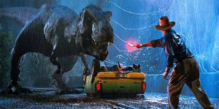 Dr. Grant waves a flare in front of the T-Rex in 'Jurassic Park'
