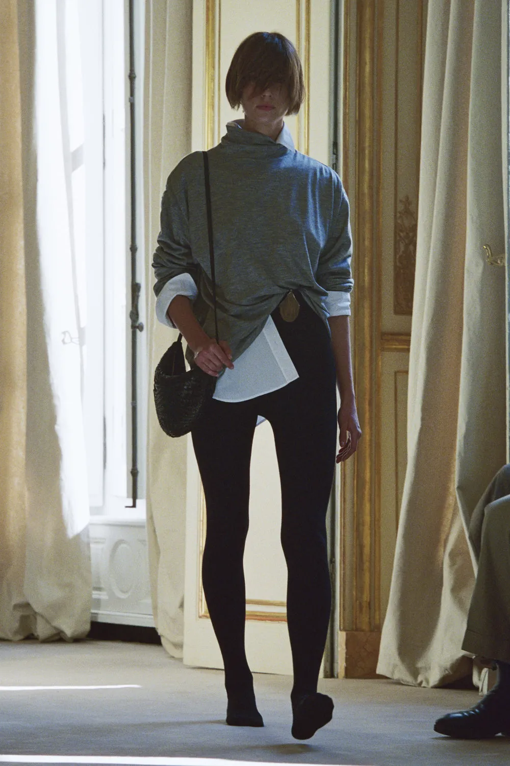 A model during the row resort 2026 show wears cashmere tights.