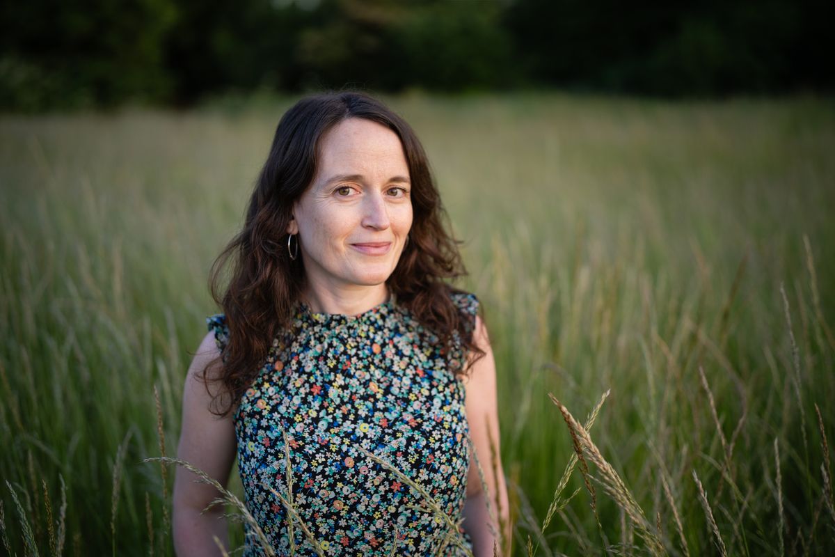 Photo of a woman in long grass taken with the Viltrox AF 35mm f/1.2 LAB FE