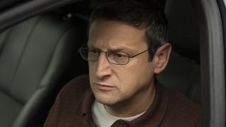 Ron Trosper frustrated sitting in his car in The Chair Company