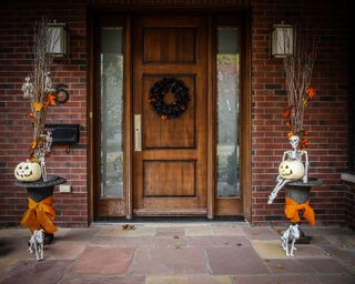skeleton decoration either side of door for halloween