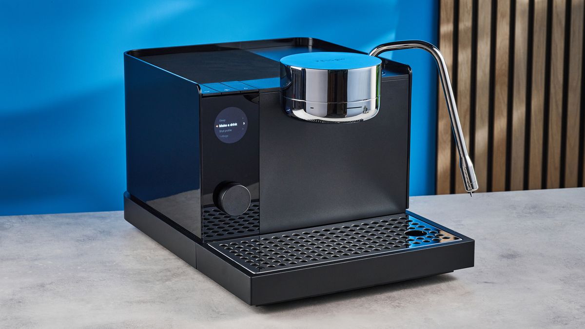 the fellow espresso series 1 photographed against a blue tom's guide background showing espresso, LCD smart screen, steam wand