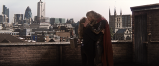 Chris Hemsworth as Thor and Natalie Portman as Jane Foster kiss