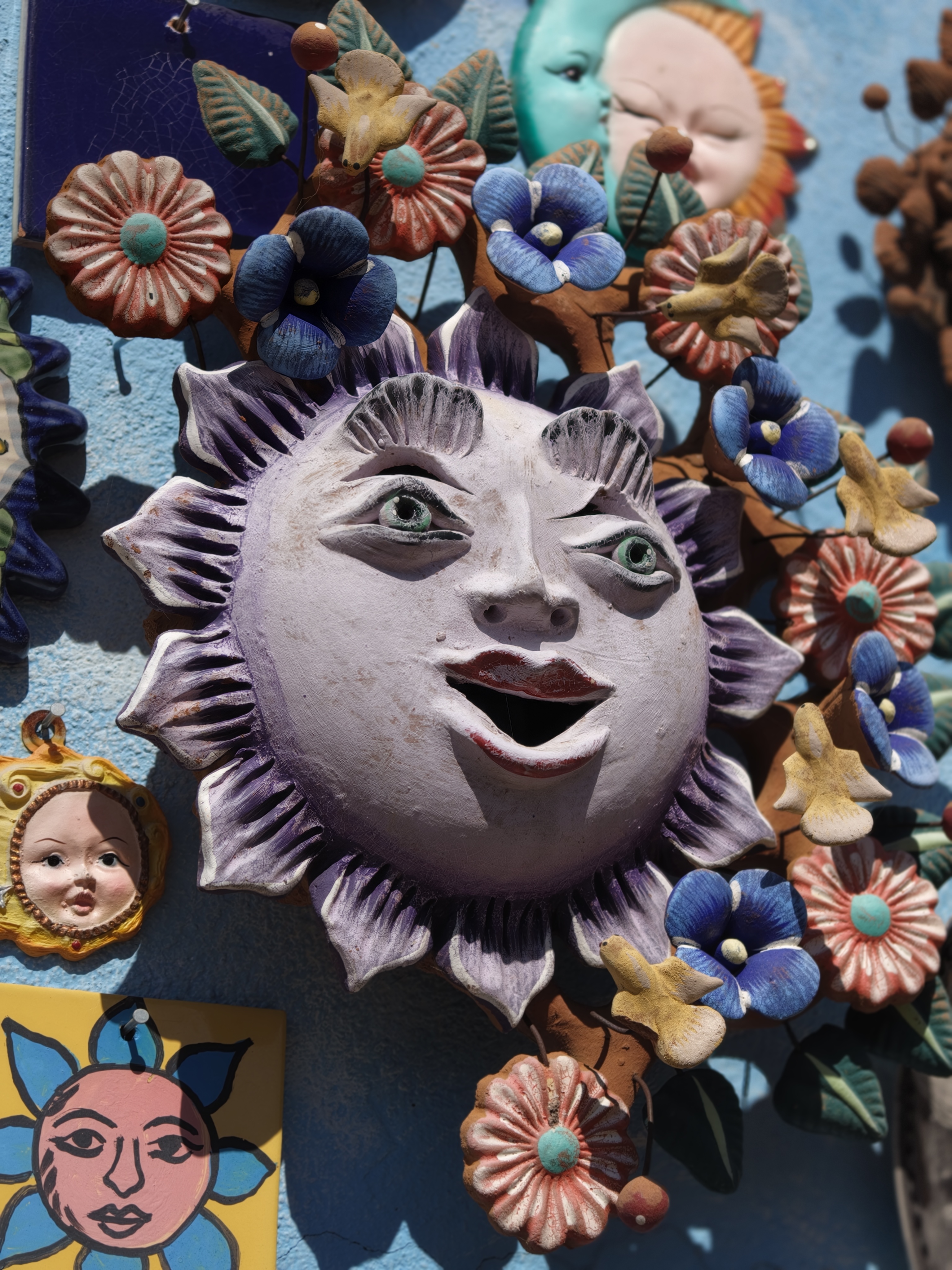 Some fun colorful suns on a wall