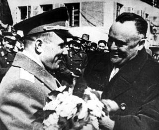 The first human ever to fly in space, cosmonaut Yuri Gagarin (left), meets with spacecraft designer Sergei Korolev.