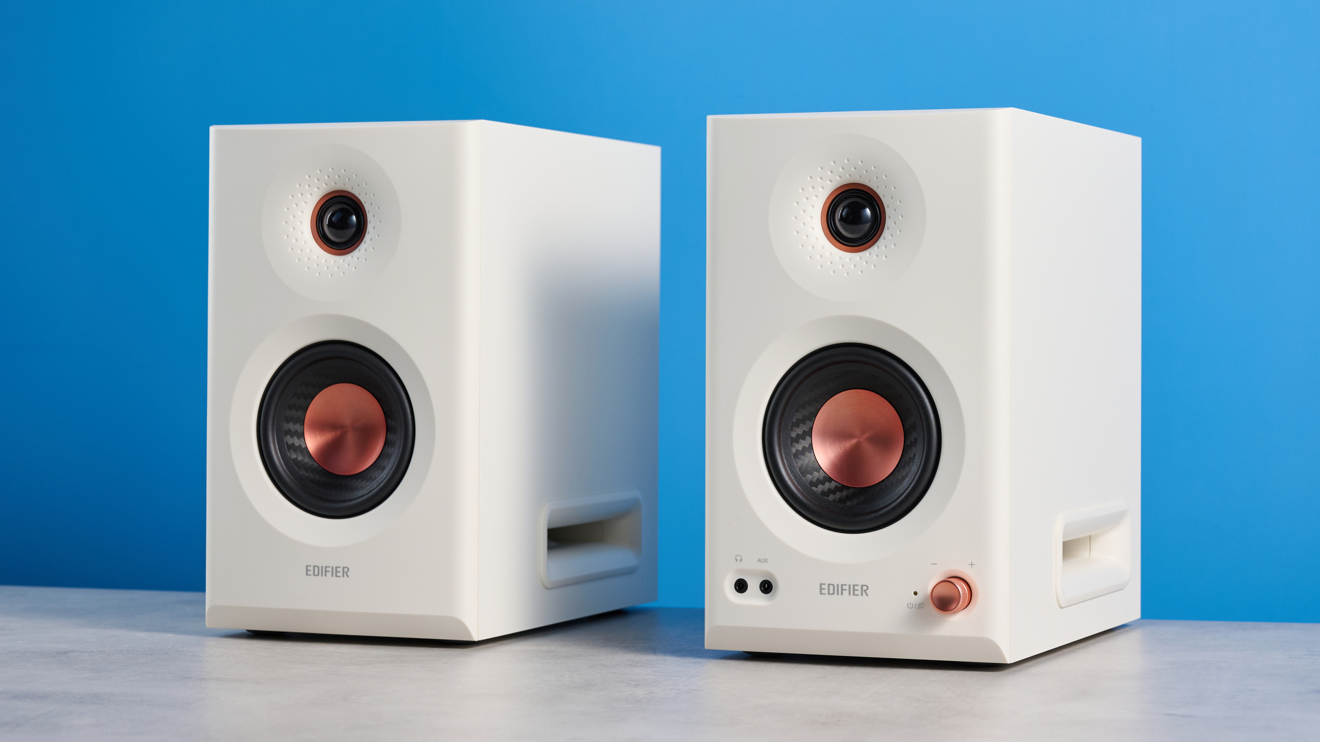 the Edifier MR5 studio monitors bookshelf speakers photographed with the blue tom's guide background