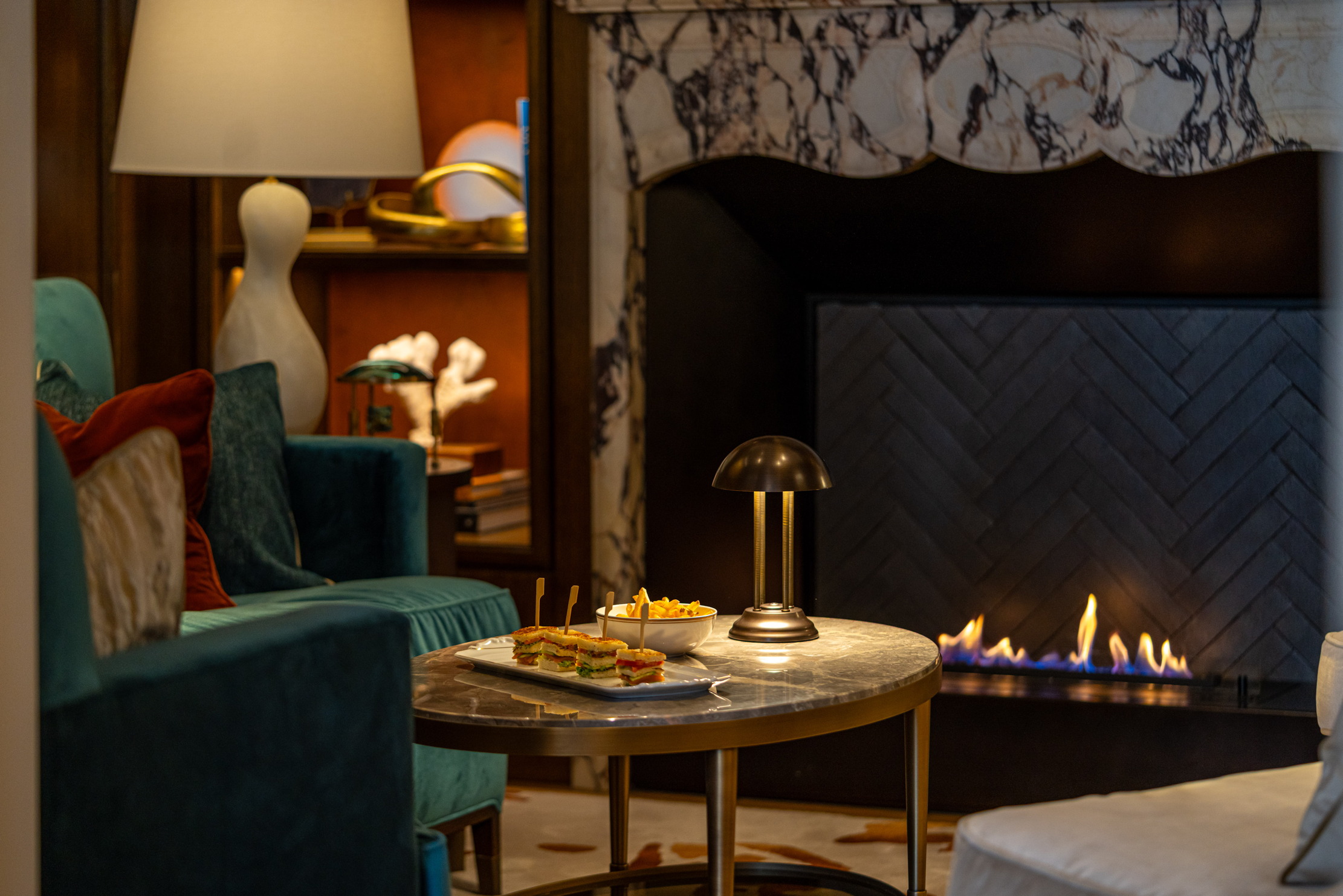 A nook at a bar with bar food on the table
