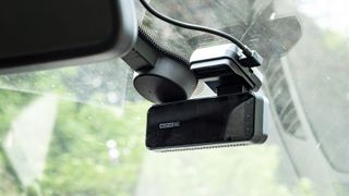 Miofive Dual Dash Cam front camera in position on a windscreen