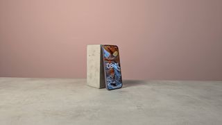 Three-quarter view of Xiaomi 17T on a desk with pink wall in background