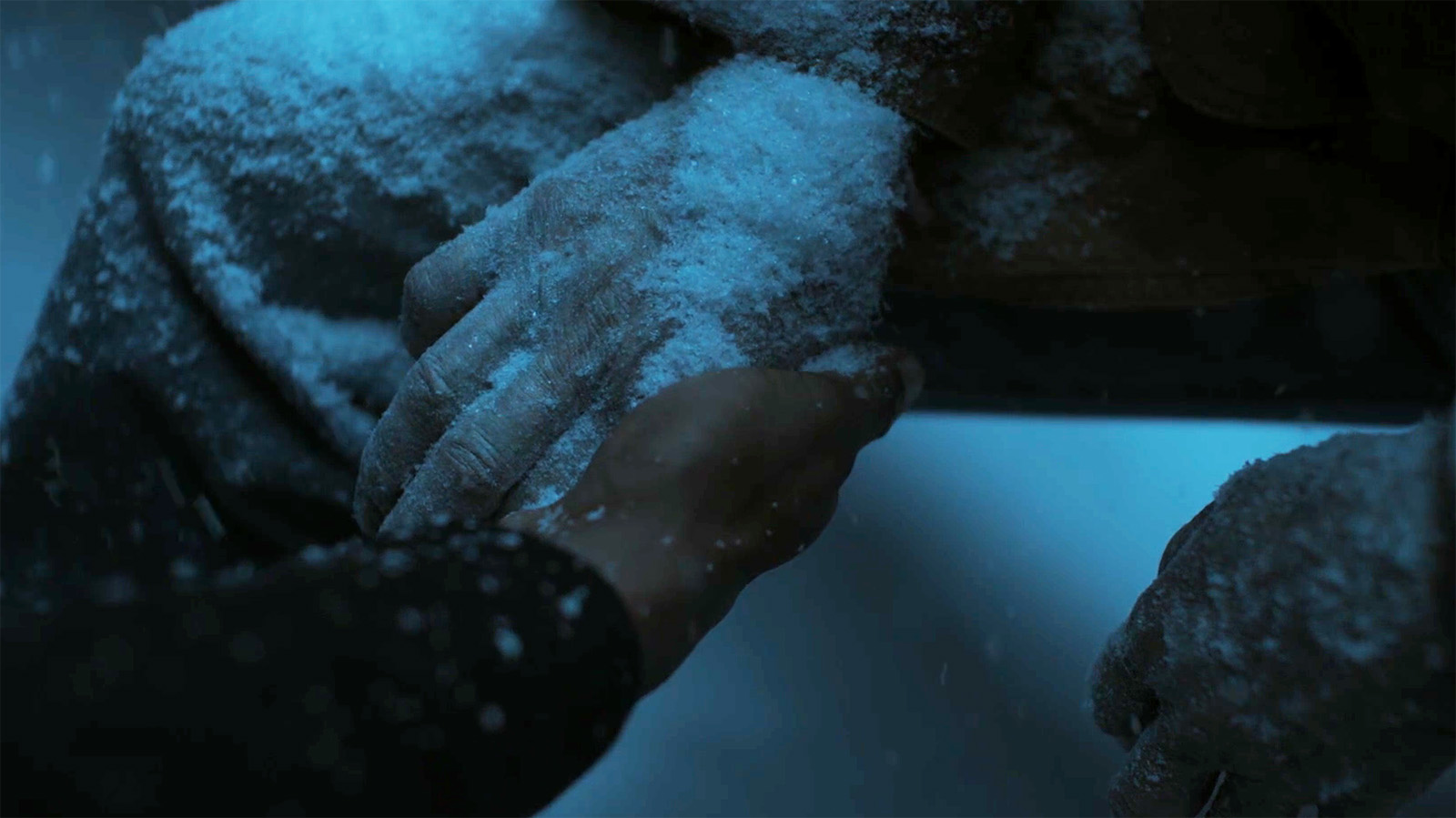 A close up of a dead Hal Jordan's right hand, which is missing its Green Lantern ring, in Lanterns episode 1