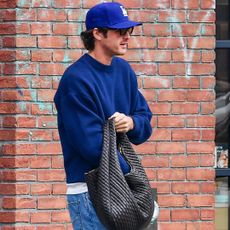 Jacob Elordi was spotted wearing bright red Nike x Jacquemus Moon sneakers and a Bottega Veneta bag