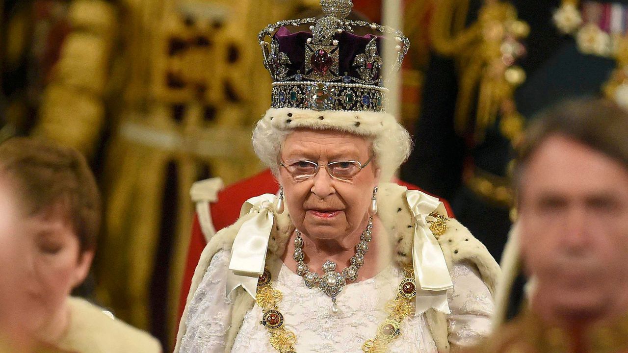 Queen Elizabeth proceeds through the Royal Gallery during the State Opening of Parliament in central London on May 18, 2016. 