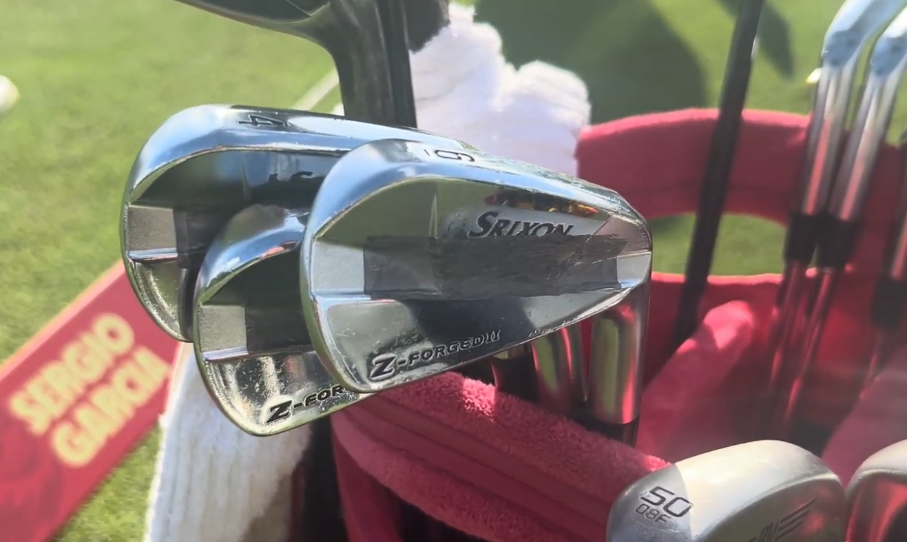 A close-up of David Puig's irons