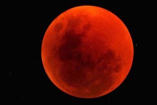 The moon turned a blood red over the Sossusvlei Desert Lodge on NamibRand Nature Reserve in Namibia in this stunning photo taken by skywatcher George Tucker on June 15, 2011.