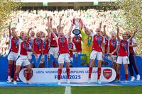LISBON, PORTUGAL - MAY 24: Kim Little and Leah Williamson of Arsenal lifts the UEFA Women's Champions League trophy after their team's victory in the UEFA Women's Champions League final match between Arsenal WFC and FC Barcelona at Estadio Jose Alvalade on May 24, 2025 in Lisbon, Portugal.