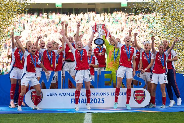LISBON, PORTUGAL - MAY 24: Kim Little and Leah Williamson of Arsenal lifts the UEFA Women's Champions League trophy after their team's victory in the UEFA Women's Champions League final match between Arsenal WFC and FC Barcelona at Estadio Jose Alvalade on May 24, 2025 in Lisbon, Portugal.