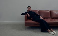 Model sitting on sofa