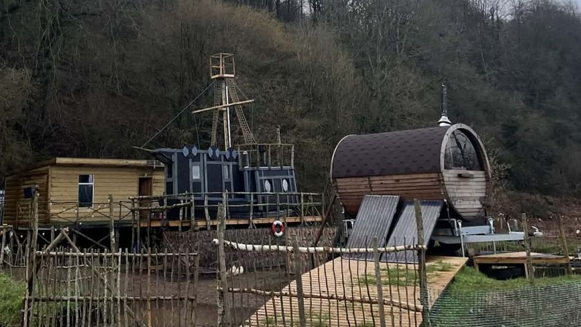 Boat house built off-grid with a wooden cabin