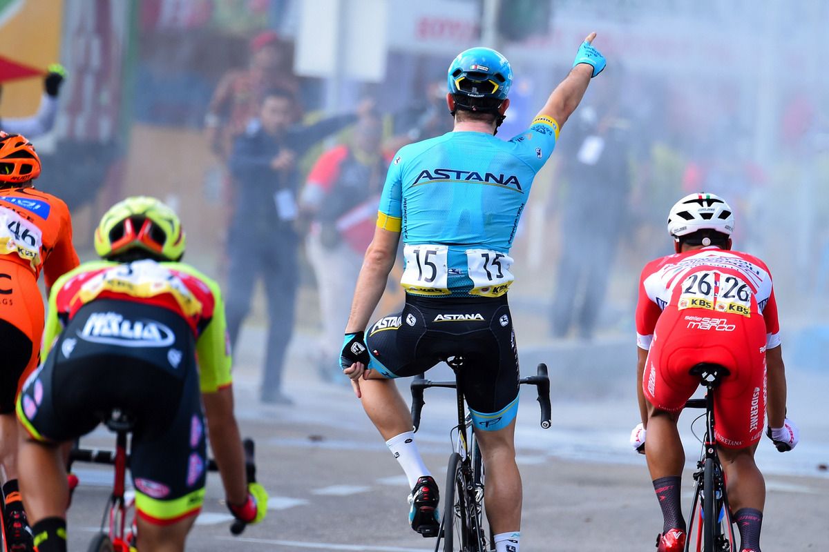The peloton's view of Riccardo Minali (Astana) celebrating the win