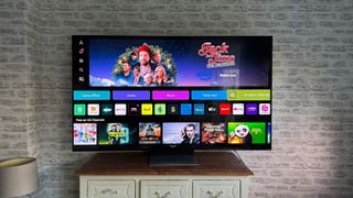 LG QNED91 65-inch LCD TV with tvOS homescreen on screen