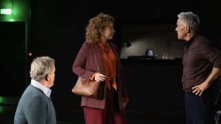 Hugh Bonneville seated as Douglas watches on as Alex Kingston as Sheila talks to Ben Miles as Toby in a studio in Douglas is Cancelled