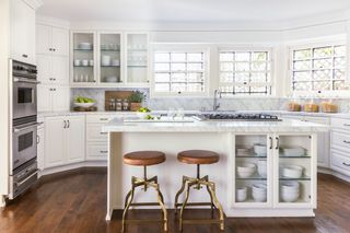 A kitchen with a white island that shows a storage unit