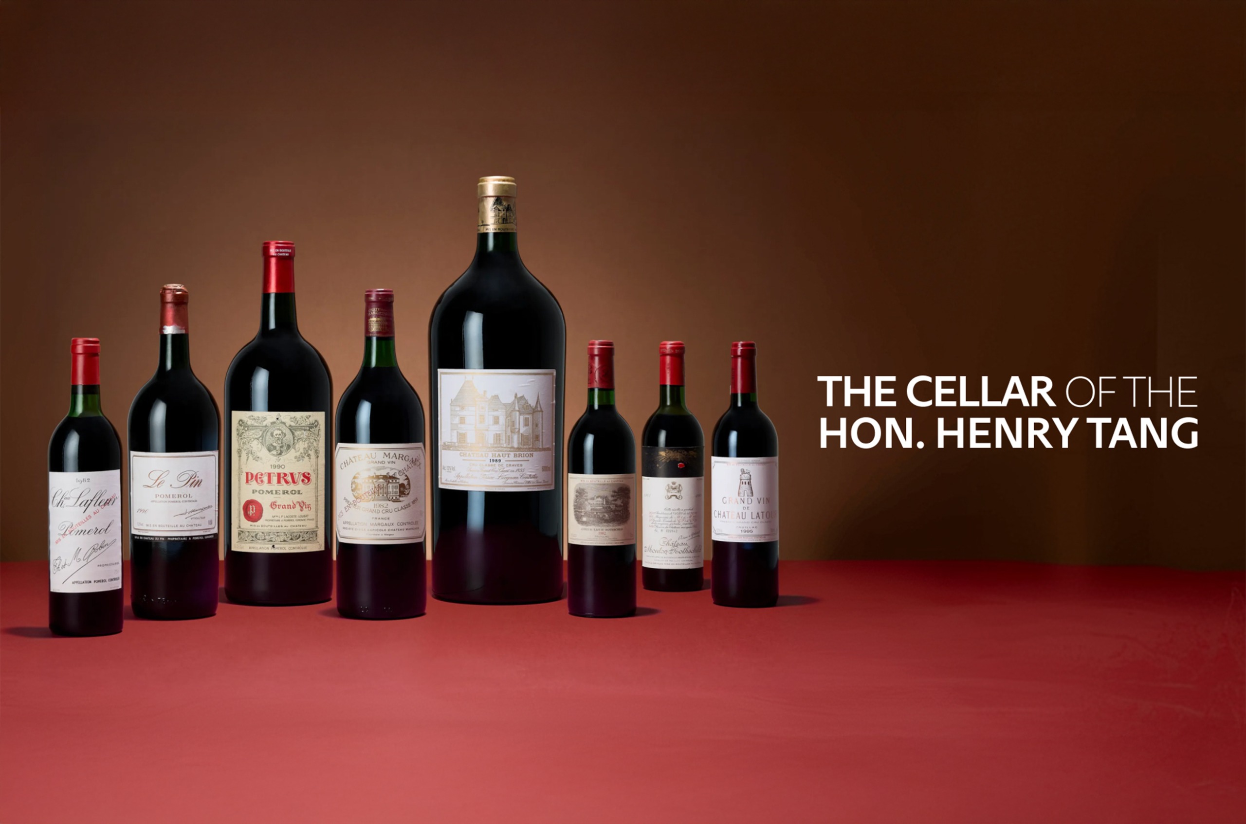 'The Cellar of the Hon. Henry Tang' with bottles of red wine in various sizes