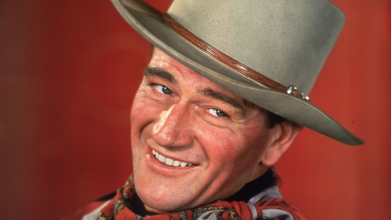 John Wayne Showed How To Use a Bold Accent Chair to Add Personality in His Traditional '40s Living Room